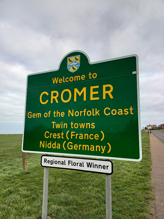 the road sign as you enter Cromer town, signifying you are now in Cromer. Text on sign says: Welcome to Cromer. Gem of the north Norfolk coast